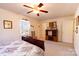 Cozy bedroom with carpet flooring, a ceiling fan, and a large window, offering a relaxing retreat at 431 Island Cove Rd # 86, Norwood, NC 28128
