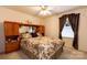 Relaxing bedroom with floral bedding, built in bookcases, and a large window at 431 Island Cove Rd # 86, Norwood, NC 28128