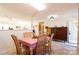 Inviting dining area with tile flooring, wooden cabinetry, and an open layout, perfect for entertaining guests at 431 Island Cove Rd # 86, Norwood, NC 28128