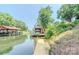 Picturesque dock with boat house, sitting area and lift offers serene waterfront access and a boat slip at 431 Island Cove Rd # 86, Norwood, NC 28128