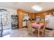 Bright eat-in kitchen featuring wooden cabinets, modern appliances, and an access door to the outdoor deck at 431 Island Cove Rd # 86, Norwood, NC 28128