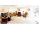 Sunlit living room featuring neutral walls, plush seating, and large windows, creating a comfortable and welcoming ambiance at 431 Island Cove Rd # 86, Norwood, NC 28128