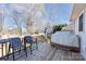 Outdoor deck area with seating, a grill, and serene views of the surrounding trees and lake at 431 Island Cove Rd # 86, Norwood, NC 28128