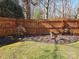 Landscaped backyard featuring a well-kept lawn, a decorative fence, and vibrant flowers adding color and appeal at 522 Rock Springs Rd, Lancaster, SC 29720