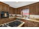 Classic kitchen with wood cabinetry, functional island, and stainless steel appliances at 522 Rock Springs Rd, Lancaster, SC 29720