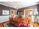 Dining room with hardwood floors and view to foyer at 610 Walnut St, Statesville, NC 28677