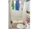 The bathroom has a toilet, tub and a small window for natural light at 642 E Black St, Rock Hill, SC 29730