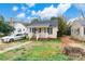 Street view of house showing cozy front porch and the surrounding yard at 642 E Black St, Rock Hill, SC 29730