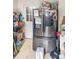 View of kitchen showing refrigerator with magnets and door leading outside at 642 E Black St, Rock Hill, SC 29730