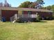 Back of the house with a wooden deck, perfect for enjoying outdoor living and the expansive backyard at 6434 Miller Rd, Kannapolis, NC 28081