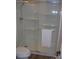 Bathroom featuring a glass shower with built-in shelving and a white towel at 6434 Miller Rd, Kannapolis, NC 28081