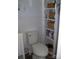 Bathroom featuring a toilet and open shelving for storage at 6434 Miller Rd, Kannapolis, NC 28081