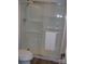 Bathroom featuring a glass shower with built-in shelving and a white towel at 6434 Miller Rd, Kannapolis, NC 28081
