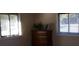 Bedroom featuring a wooden dresser placed in between two windows with natural light at 6434 Miller Rd, Kannapolis, NC 28081