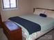 Bedroom with comfortable queen bed and wooden chest at the foot of the bed at 6434 Miller Rd, Kannapolis, NC 28081