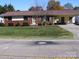 Charming single-story home with brick facade, manicured lawn, and convenient carport at 6434 Miller Rd, Kannapolis, NC 28081