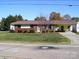 Charming single-story home with brick facade, manicured lawn, and convenient carport at 6434 Miller Rd, Kannapolis, NC 28081