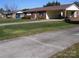Single-story home with carport, showcasing its well-maintained lawn and cozy curb appeal at 6434 Miller Rd, Kannapolis, NC 28081