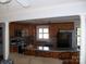 Kitchen and living room combination featuring wood cabinets, stainless appliances, and a breakfast bar at 6434 Miller Rd, Kannapolis, NC 28081