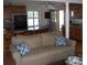 Cozy living room with kitchen views, ample seating on a comfortable couch, and natural light at 6434 Miller Rd, Kannapolis, NC 28081