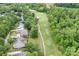 Aerial view of the property showcases its desirable location with golf course access and mature landscaping at 7191 Grist Mill Ct, Denver, NC 28037