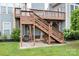 Multi-level deck and patio area offering outdoor entertainment space and serene views of the landscaped backyard at 7191 Grist Mill Ct, Denver, NC 28037
