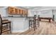 Basement featuring a bar with seating and adjacent billiards table at 7191 Grist Mill Ct, Denver, NC 28037