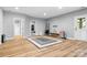 Finished basement with wood-look floors and recreational space, perfect for entertaining and Gathering fun at 7191 Grist Mill Ct, Denver, NC 28037