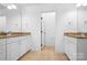 Bright bathroom featuring double sinks with granite counters and white cabinets at 7191 Grist Mill Ct, Denver, NC 28037