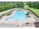 Large community pool with slides, seating and umbrellas offers residents a relaxing recreation space at 7191 Grist Mill Ct, Denver, NC 28037