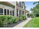 Classic home showcasing stone and siding, complemented by manicured landscaping and a paved walkway at 7191 Grist Mill Ct, Denver, NC 28037