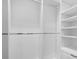 Organized walk-in closet with shelving and hanging rods, providing ample storage space for clothing at 7191 Grist Mill Ct, Denver, NC 28037