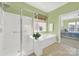 Bathroom featuring a separate shower and tub, and a view to the bedroom at 7203 Shenandoah Dr, Fort Mill, SC 29707