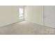 Empty bedroom with carpet, a window, and a door at 7203 Shenandoah Dr, Fort Mill, SC 29707