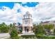A charming clubhouse featuring traditional architecture with clock tower and manicured landscaping at 7203 Shenandoah Dr, Fort Mill, SC 29707