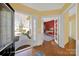 Bright foyer welcomes you with hardwood floors, open doorways and views of the front yard and office at 7203 Shenandoah Dr, Fort Mill, SC 29707