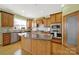 Another view of the expansive kitchen featuring stainless steel appliances and an island with granite countertop at 7203 Shenandoah Dr, Fort Mill, SC 29707
