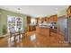 Expansive kitchen with hardwood floors, a breakfast nook, and modern stainless steel appliances at 7203 Shenandoah Dr, Fort Mill, SC 29707