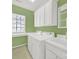 Bright laundry room features a large window, cabinetry, washer, dryer, and utility sink at 7203 Shenandoah Dr, Fort Mill, SC 29707