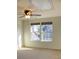 Bedroom with neutral walls, carpet, and a ceiling fan featuring dual windows providing views and natural light at 8471 Penton Pl, Harrisburg, NC 28075