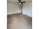 Bedroom featuring neutral walls, carpet flooring, doors, and a ceiling fan at 8471 Penton Pl, Harrisburg, NC 28075
