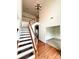 Bright foyer with hardwood floors and staircase, creating an inviting entryway with ample natural light at 8471 Penton Pl, Harrisburg, NC 28075