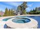 The backyard features a large pool and spa, offering a luxurious and relaxing outdoor experience at 8471 Penton Pl, Harrisburg, NC 28075