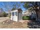 Outdoor shed in backyard is perfect for storing tools and lawn equipment at 8471 Penton Pl, Harrisburg, NC 28075