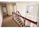 Upper view of the staircase and foyer, with abundant natural light and open space at 8471 Penton Pl, Harrisburg, NC 28075