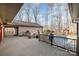 Expansive back deck with pool and gazebo overlooking treed backyard at 1006 Lost Cv, Weddington, NC 28104