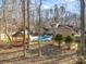 Backyard features in-ground pool, gazebo, and mix of woods and mature landscaping at 1006 Lost Cv, Weddington, NC 28104