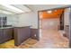 Wet bar with a view of the living room featuring a wood ceiling and fireplace at 1006 Lost Cv, Weddington, NC 28104