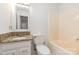 Bathroom with a granite vanity top, toilet, and a tub and shower combo at 1006 Lost Cv, Weddington, NC 28104