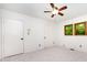 Bedroom featuring plush carpeting, ceiling fan, and natural light from the windows at 1006 Lost Cv, Weddington, NC 28104